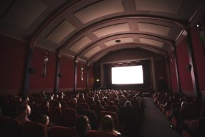 Cinemagoers facing towards a cinema screen