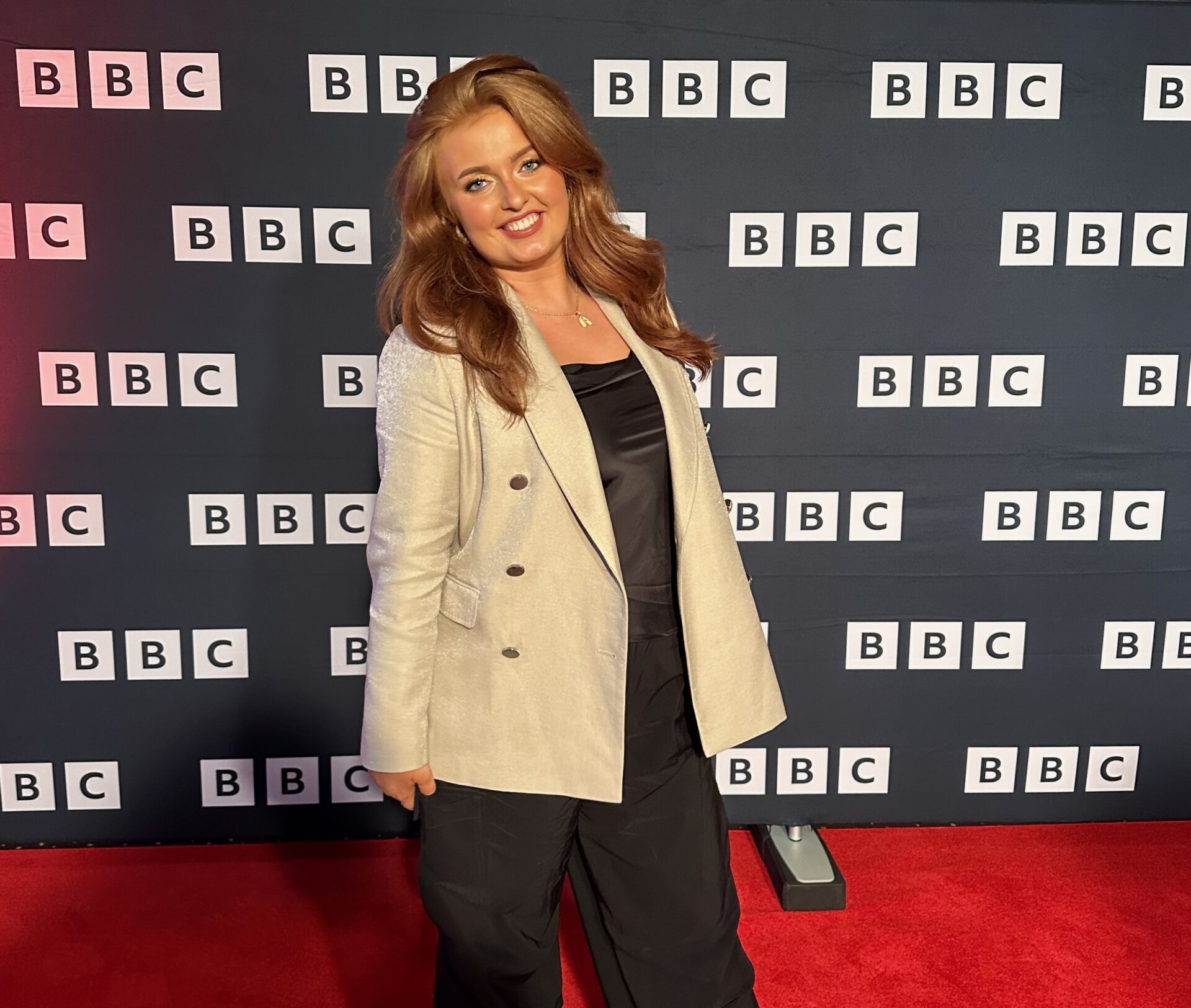 Alexa Williams stands on the BBC Red Carpet at a premiere