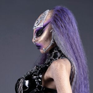 Prosthetic and makeup alien woman with purple hair