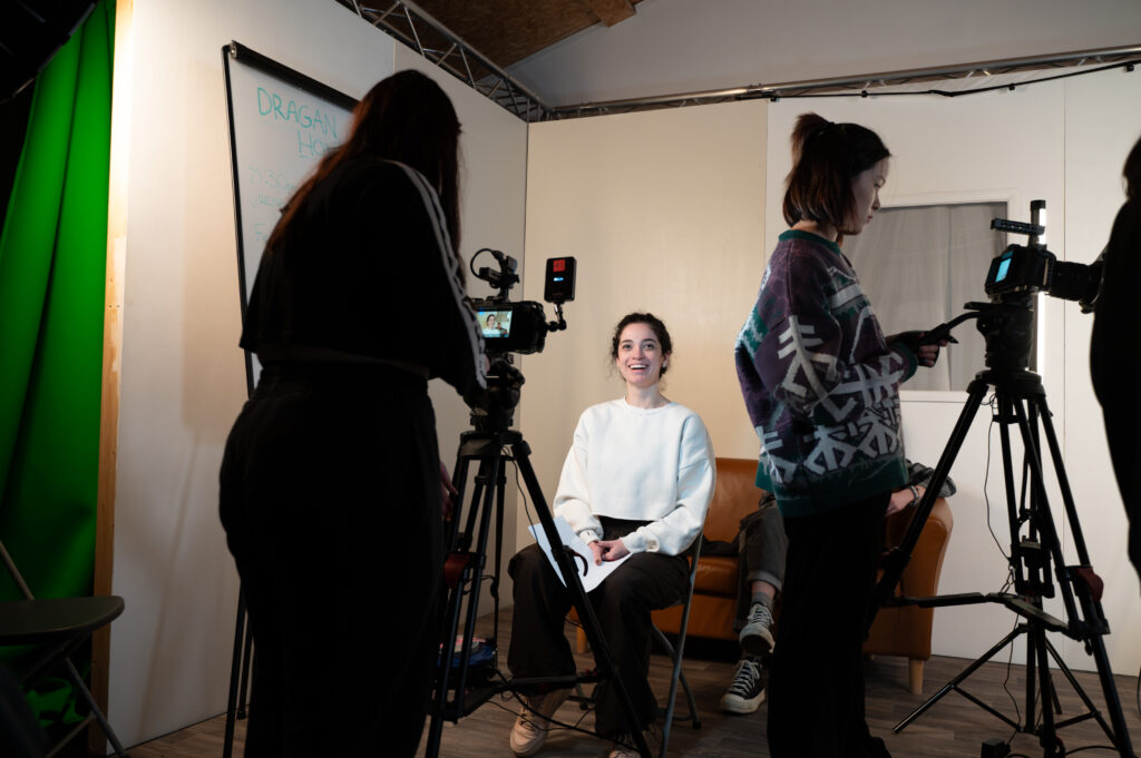 Camila sits in front of camera during an acting class