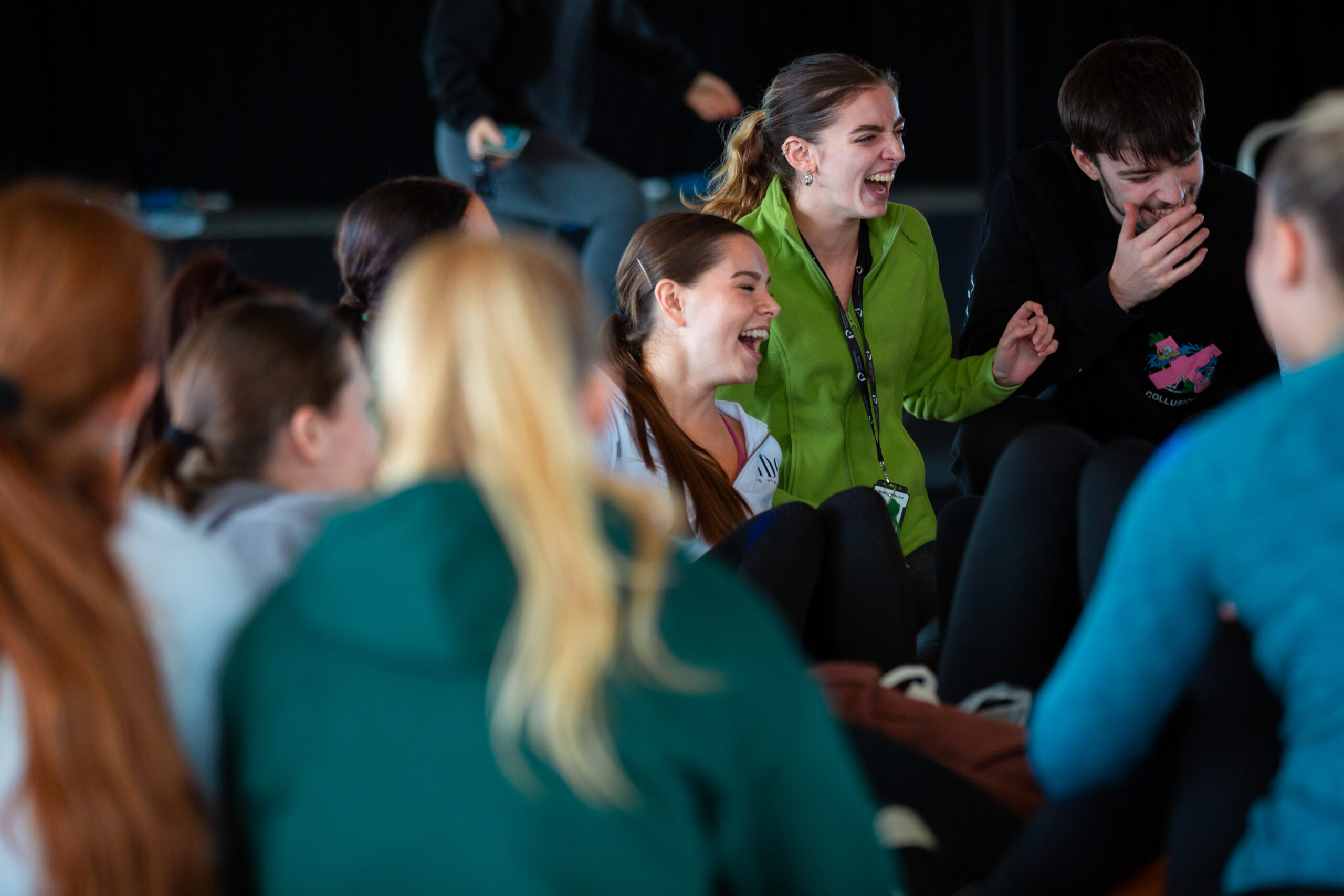 students laugh as the socialise on campus