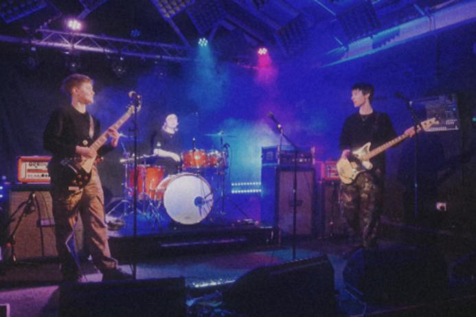 The Shelters, a band from BIMM Birmingham, performing at a gig.